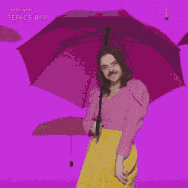 a woman with a mustache is dancing in front of a blue wall with reface app written on it
