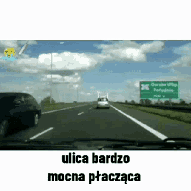 a car is driving down a highway next to a green sign that says ulica bardo mocna ptaczka .