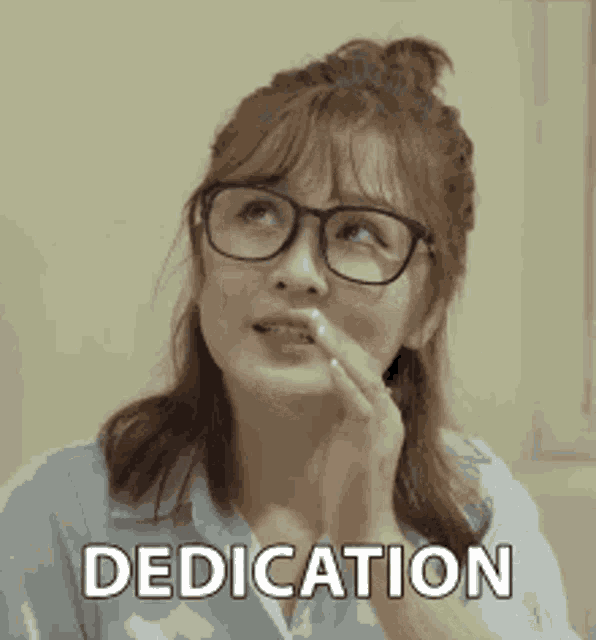 a woman wearing glasses is making a face and the word dedication is on the bottom