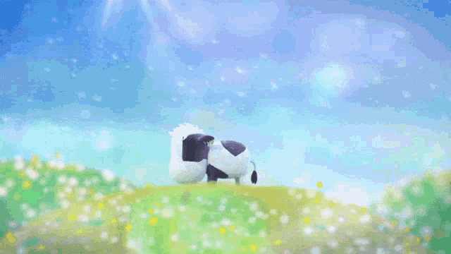 a black and white cow stands on top of a grassy hill