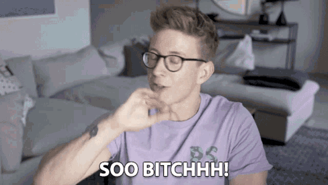 a man wearing glasses and a purple shirt says " soo bitchhhh "