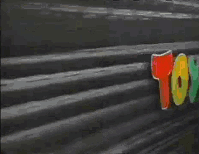 a colorful sign that says `` toys '' on it .