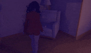 a shadow of a person is cast on a wall and a chair
