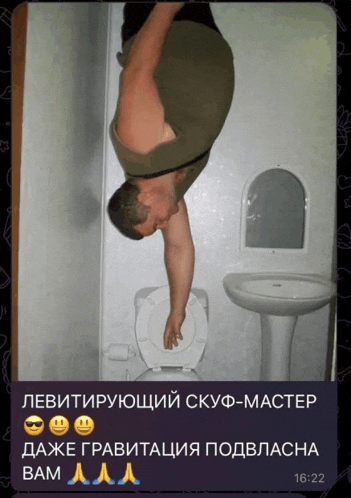 a man is upside down in a bathroom next to a sink