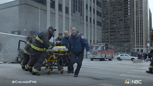 Rescuing A Patient Chicago Fire GIF - Rescuing A Patient Chicago Fire Saving A Patient GIFs