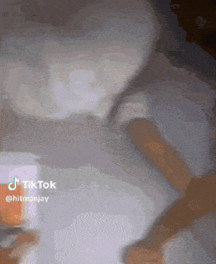 a close up of a person 's face with the words tiktok @hitmanjay below it