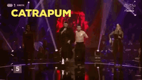 a group of people on a stage with the word catrapum written on the bottom
