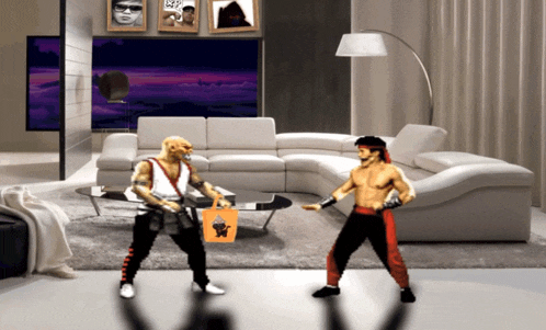 two fighters are standing in front of a couch in a living room with pictures on the wall