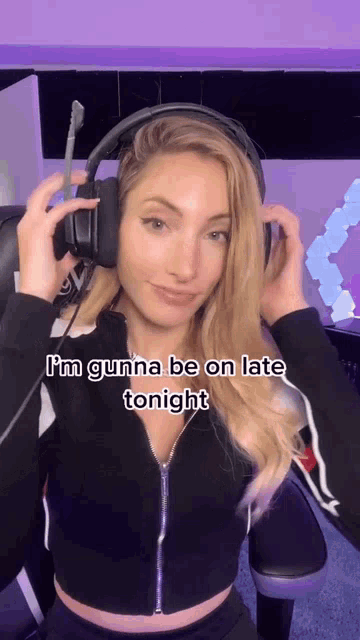 a woman is wearing headphones and says i 'm gunna be on late tonight