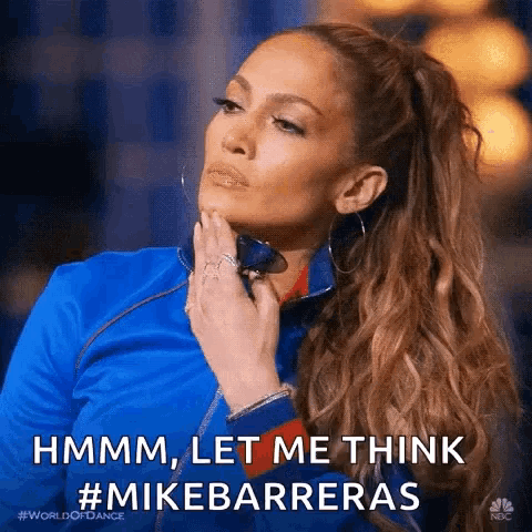 a woman in a blue jacket is holding her hand to her chin and saying hmm , let me think #mikebarreras .