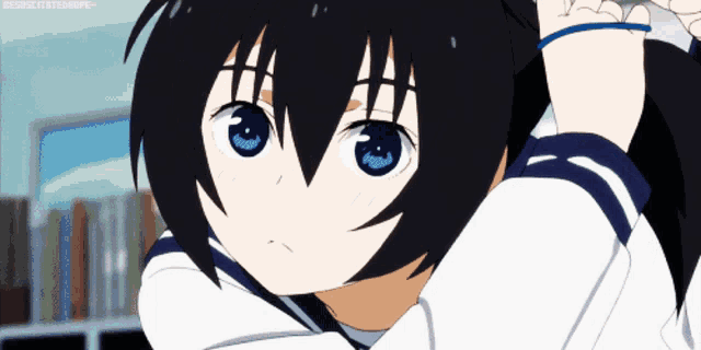 a girl with black hair and blue eyes has a blue band around her wrist that says jesuschristerhope