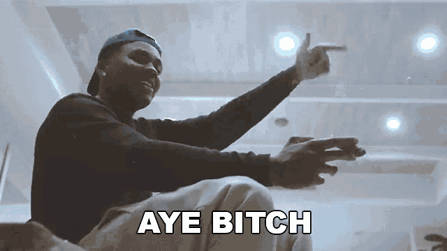 a man sitting down with the words aye bitch written on the bottom