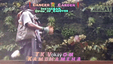 a man is standing in front of a wall of flowers with the words " dancer garden " on top
