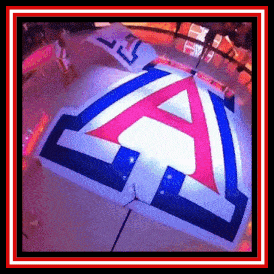 a red white and blue umbrella with an a on it