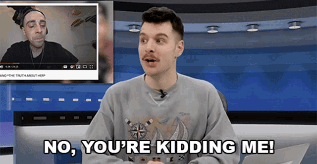 a man says no you 're kidding me in front of a video