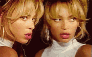 two women are looking at each other and making funny faces