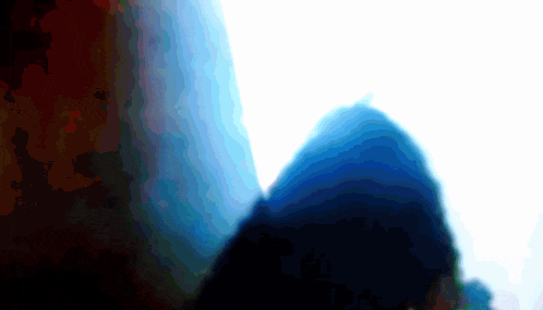 a blurred image of a person 's shadow with a blue sky in the background