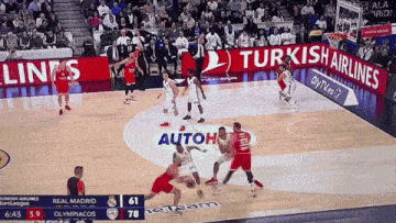 a basketball game between real madrid and olympiacos with turkish airlines ads