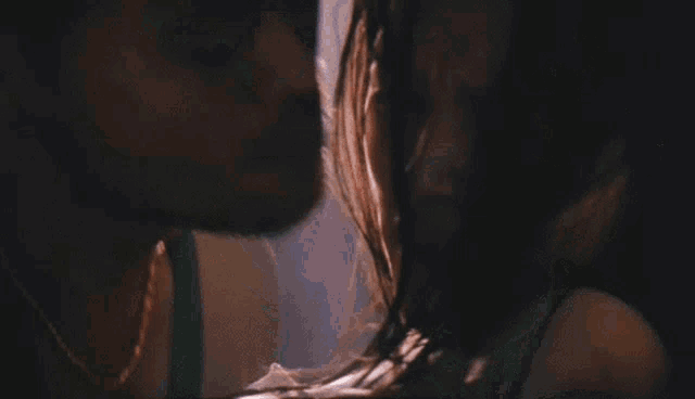 a man is holding a woman in his arms in a room .