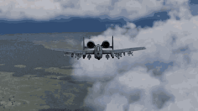 a fighter jet is flying through the clouds with the number 0 on the tail