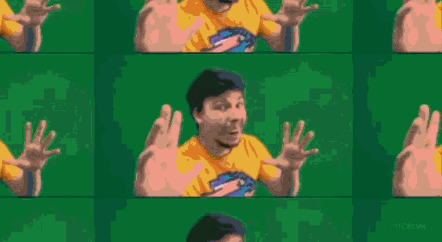 a man wearing an orange shirt with a picture of a rabbit on it