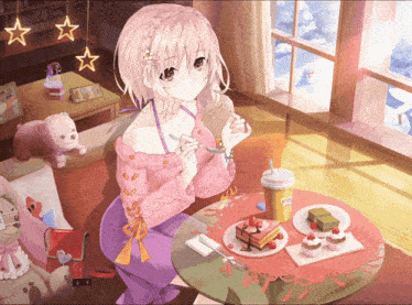 a girl in a pink sweater is sitting at a table with a cup of coffee and a plate of desserts