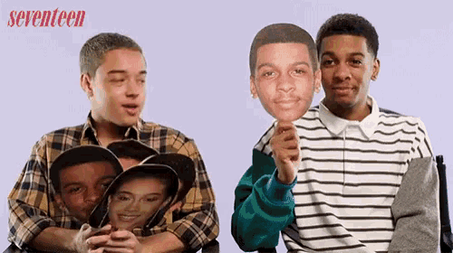 a seventeen ad with two people holding masks of themselves