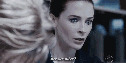 a close up of a woman 's face with the words `` are we alive '' .