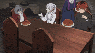 a group of people sitting around a table with a woman carrying plates