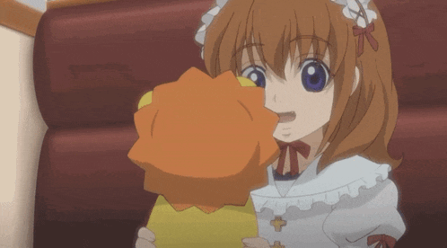 a girl in a maid outfit holds a stuffed animal