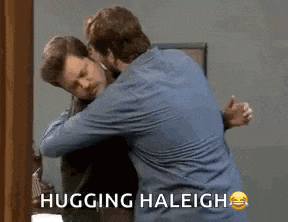 two men hugging each other in front of a mirror with the words hugging haleigh written on the bottom .