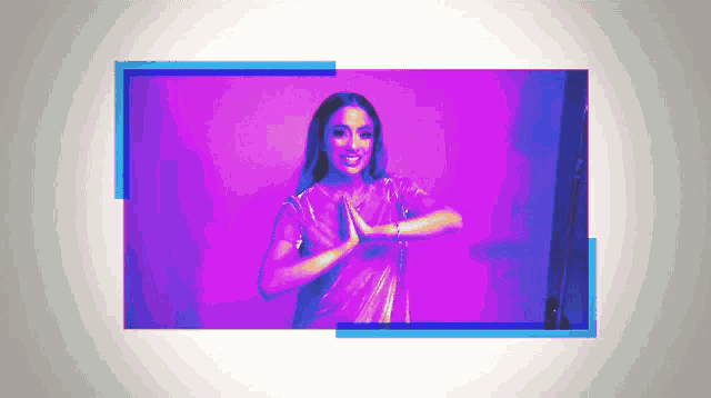 a woman is standing in front of a purple background with a blue frame around her