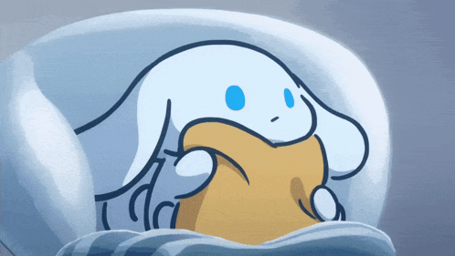 a cartoon drawing of a rabbit laying in a bed