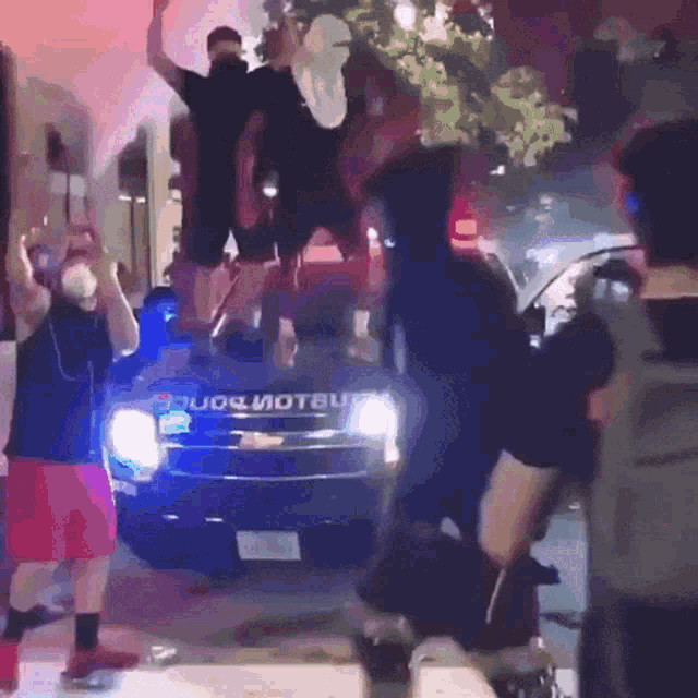 a group of people standing in front of a jeep that says ' jeep ' on it