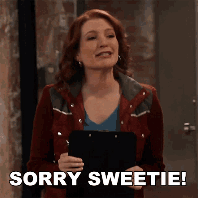 a woman in a red jacket is holding a clipboard and says sorry sweetie