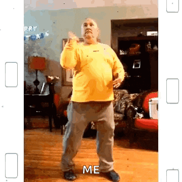 a man in a yellow shirt is dancing in a living room with the words `` me '' written on the bottom of the screen .