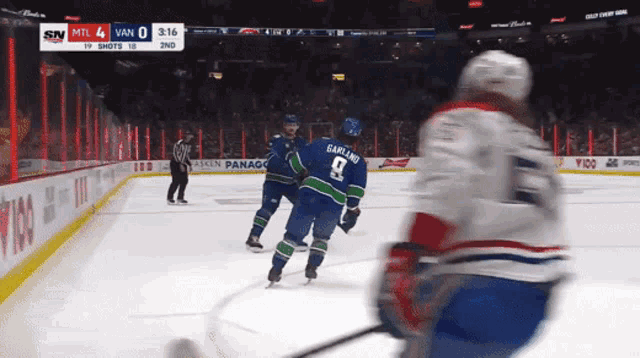a hockey game between vancouver and montreal is underway