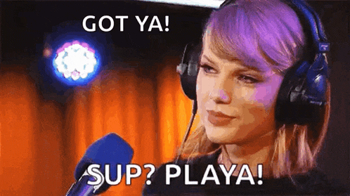 taylor swift is wearing headphones and talking into a microphone with the words `` got ya ! sup ? playa ! ''