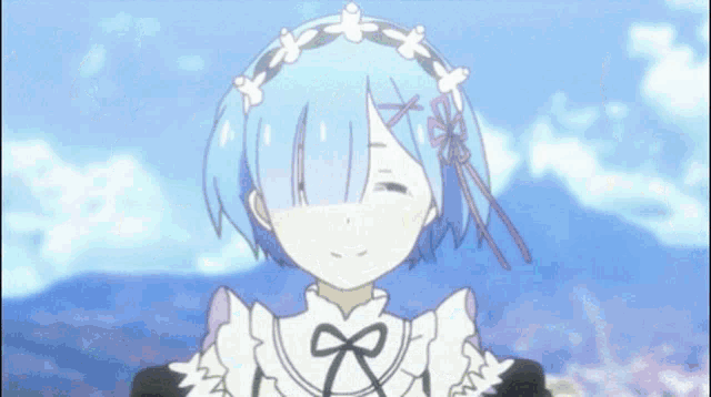 a girl with blue hair and a bow in her hair smiles