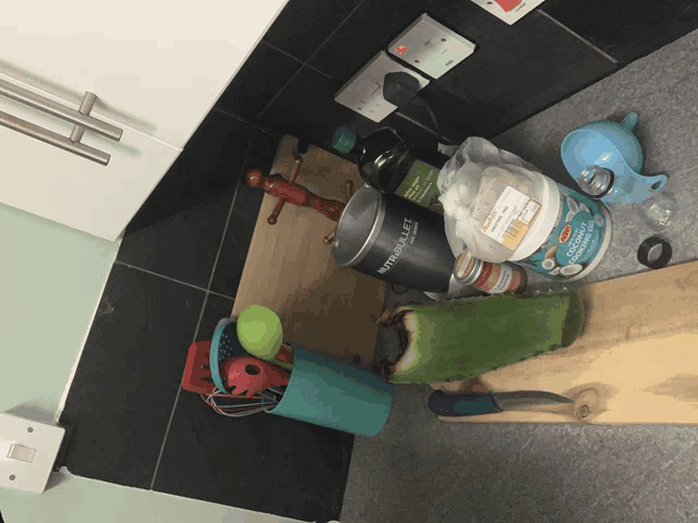 a kitchen counter has a container that says nutribullet on it