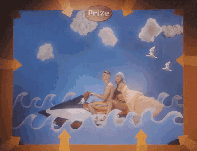 a picture of a man and a woman on a jet ski with the word prize above them