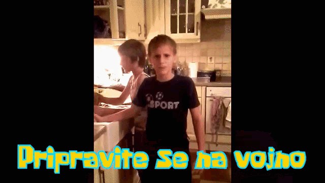 a boy wearing a black shirt that says sport
