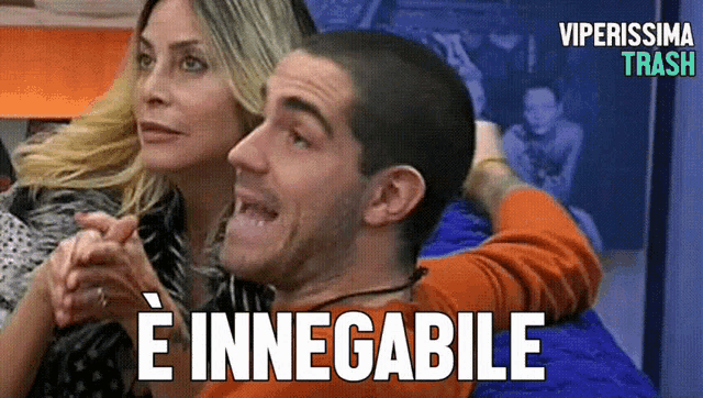 a man and a woman are sitting next to each other with the words " e innegabile " on the bottom