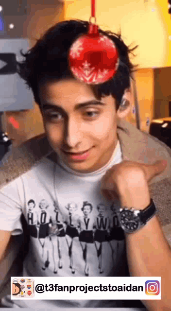 a young man wearing a t-shirt with hollywood on it