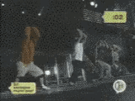 a group of people are dancing in a dark room with a yellow sticker that says 2:02