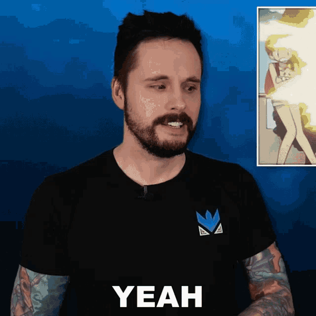 a man with a beard wearing a black t-shirt that says yeah