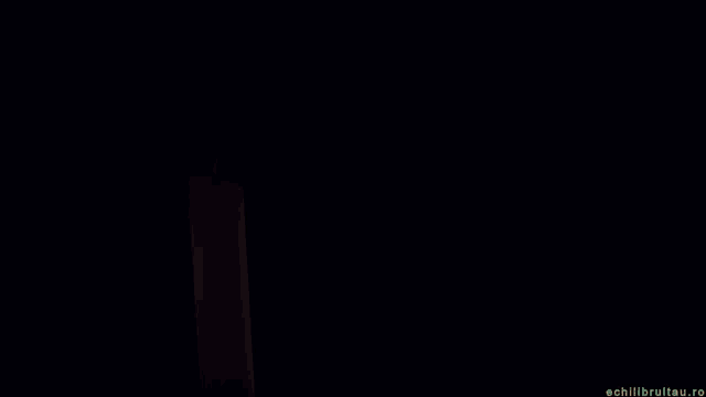 a candle is lit up on a black background with the words lumina speranta si multa iubire
