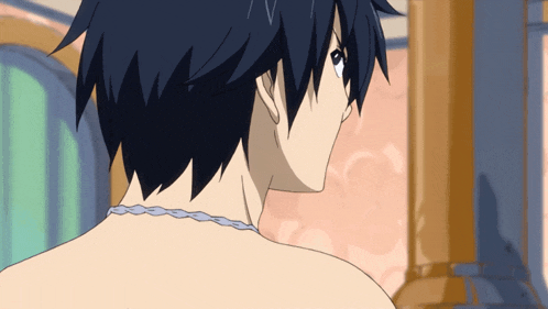 a close up of a person 's back with a necklace around his neck