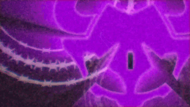 a purple symbol is surrounded by barbed wire on a dark background