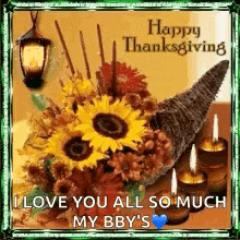a happy thanksgiving card with a cornucopia filled with flowers and candles